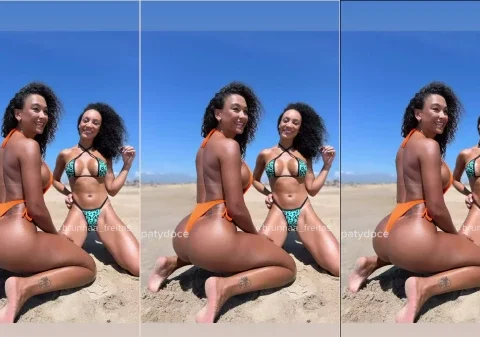 Duas gostosas na praia usando um biquíni fio dental