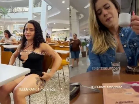 Dupla safada tirando a calcinha na praça de alimentação e provocando os homens