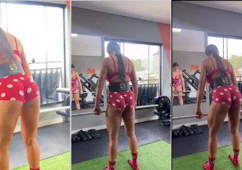 Mulher fitness treinando na academia com um shortinho curto socado na raba